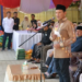 Wakil Gubernur Aceh, Fadhlullah, SE, saat menyampaikan sambutan pada peluncuran Gerakan Pangan Murah, yang diselenggarakan Dinas Pangan Aceh di halaman Masjid Baitul Istiqamah Gampong Teupien Raya. Kec. Glumpang Tiga, Kab. Pidie, Rabu (26/3/2025).