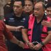 Dadan Hindayana keluar dari Gedung Jampidsus Kejaksaan Agung dengan rompi merah muda